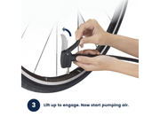 Instruction graphic showing a person's hands using a black bicycle pump to inflate a tire, with a blue arrow indicating engagement and the text '3 Lift up to engage. Now start pumping air.