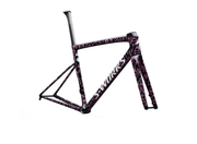 Bicycle frame with pink and black design on a white background