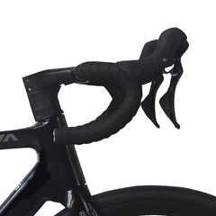 Black drop handlebar tape and brake levers installed on a black road bicycle frame, shown against a solid white background.