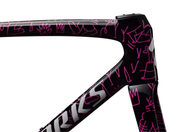Black bicycle frame with pink designs and 'Fizik' branding on a white background