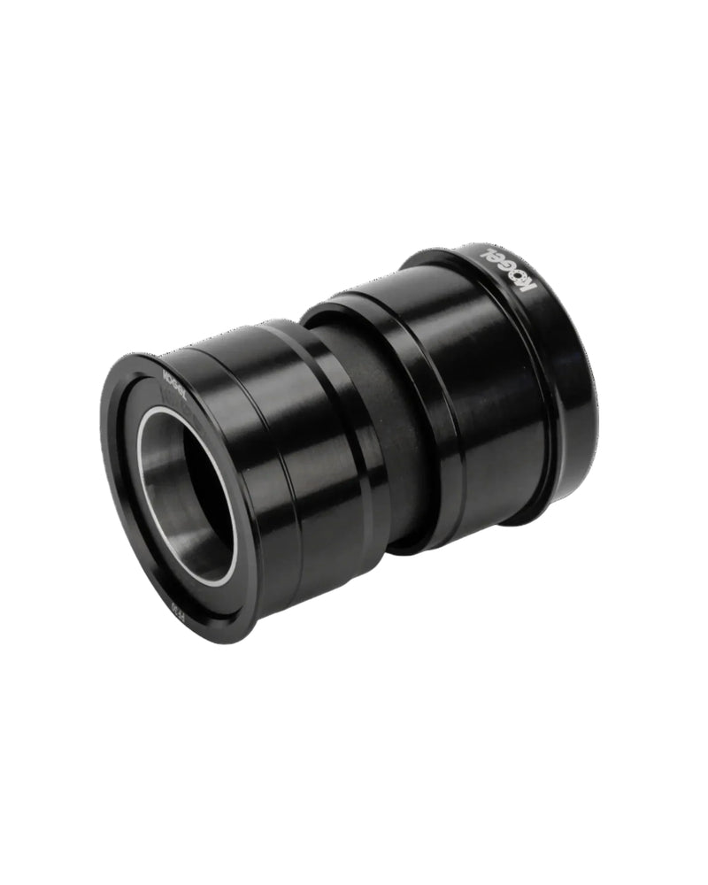 The Kogel Ceramic Bottom Bracket BBR-DUB is a black cylindrical mechanical bearing with metallic inner rings and a smooth outer surface, ideal for upgrading your road bike's SRAM DUB crankset. Shown isolated on a white background.
